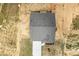 New home featuring a gray shingled roof, concrete driveway, and partially landscaped yard in a developing community at 178 Grove Township Way, Angier, NC 27501