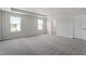 Spacious bedroom with large windows and soft carpeting creates a serene atmosphere at 178 Grove Township Way, Angier, NC 27501