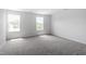 Bright bedroom with two windows and neutral carpeting at 178 Grove Township Way, Angier, NC 27501