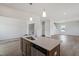Kitchen island with stainless steel dishwasher and faucet, blending seamlessly into the living area at 178 Grove Township Way, Angier, NC 27501