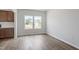 Bright living room showcasing hardwood floors and natural light from the double windows at 178 Grove Township Way, Angier, NC 27501