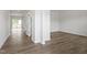 Bright living room with wood-look flooring, white walls, and an inviting view of the outdoors at 178 Grove Township Way, Angier, NC 27501