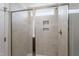 Modern shower with glass door, tiled walls, and built-in niche for toiletries at 178 Grove Township Way, Angier, NC 27501