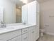 This bathroom features a double sink with modern fixtures and white cabinetry at 1813 Bright Lantern Way, Wendell, NC 27591