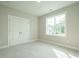 Inviting bedroom with carpet flooring, double door closet, and bright window views at 1813 Bright Lantern Way, Wendell, NC 27591