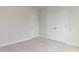 Bedroom with carpet, a walk-in closet, and neutral walls creating a blank canvas at 1813 Bright Lantern Way, Wendell, NC 27591