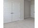 The bedroom has neutral carpet with nice double doors at 1813 Bright Lantern Way, Wendell, NC 27591