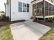 The exterior has a view of the porch and a concrete patio at 1813 Bright Lantern Way, Wendell, NC 27591