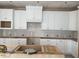 New construction kitchen with white cabinets and center island at 1813 Bright Lantern Way, Wendell, NC 27591