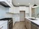 Stylish kitchen with white cabinets, stainless steel appliances, and a bright, airy layout at 1813 Bright Lantern Way, Wendell, NC 27591