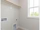 Functional laundry room with natural light and hookups for appliances at 1813 Bright Lantern Way, Wendell, NC 27591