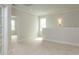 Upstairs living room with neutral walls, plush carpet, natural light, and an open floor plan at 1813 Bright Lantern Way, Wendell, NC 27591