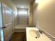 Bathroom featuring shower-tub combo with neutral tile surround and vanity area at 19 E American Marigold Dr # 34, Benson, NC 27504