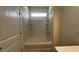Clean bathroom with tub-shower and tile surround, providing a refreshing and functional space at 19 E American Marigold Dr # 34, Benson, NC 27504