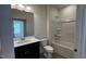 Well-lit bathroom with a single sink vanity, toilet, and shower-tub combination at 19 E American Marigold Dr # 34, Benson, NC 27504