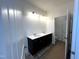 Bathroom with double sink vanity, framed mirror, and great lighting at 19 E American Marigold Dr # 34, Benson, NC 27504