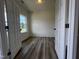 Bright bedroom with wood-look floors and a large window, offering a serene atmosphere at 19 E American Marigold Dr # 34, Benson, NC 27504