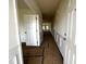 Hallway with view of living area, white trim and neutral paint ready for personal touches at 19 E American Marigold Dr # 34, Benson, NC 27504