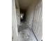 Hallway with concrete flooring and white trim detailing leads to various rooms in the home at 19 E American Marigold Dr # 34, Benson, NC 27504