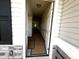 Bright hallway with white wainscoting, neutral walls, and visible doorways to other rooms at 19 E American Marigold Dr # 34, Benson, NC 27504