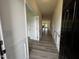 Inviting hallway with wood-look flooring and stylish trim, leading to the living area at 19 E American Marigold Dr # 34, Benson, NC 27504