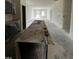 Kitchen island and cabinets are covered with plastic to protect them during the final construction phases at 19 E American Marigold Dr # 34, Benson, NC 27504