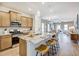 A kitchen with stainless steel appliances, granite countertops, and a breakfast bar at 19 E American Marigold Dr # 34, Benson, NC 27504