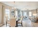 An open floor plan combining the living and dining areas is bathed in natural light at 19 E American Marigold Dr # 34, Benson, NC 27504