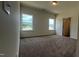 Comfortable main bedroom featuring two large windows and plush carpeting for a cozy feel at 19 E American Marigold Dr # 34, Benson, NC 27504
