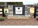 Community sign featuring the name ALDER CREEK with stone detail and landscaping in the front at 19 E American Marigold Dr # 34, Benson, NC 27504