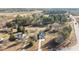 Aerial view of a house on a large lot with a detached garage and trees at 20 Wes Sandling Rd, Franklinton, NC 27525