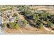 Aerial view of a property with a house, pool and surrounding undeveloped land at 20 Wes Sandling Rd, Franklinton, NC 27525