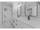 Bathroom with double sink vanity and an open doorway to a shower and toilet at 20 Wes Sandling Rd, Franklinton, NC 27525