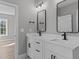 Double vanity bathroom with modern fixtures at 20 Wes Sandling Rd, Franklinton, NC 27525