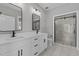 Main bath with double vanity, marble shower, and modern fixtures at 20 Wes Sandling Rd, Franklinton, NC 27525