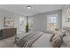 Bedroom featuring a bed and a bathroom with a double sink vanity at 20 Wes Sandling Rd, Franklinton, NC 27525
