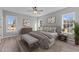 Beautifully furnished bedroom featuring a ceiling fan, wood flooring, and lots of natural light at 20 Wes Sandling Rd, Franklinton, NC 27525