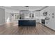 Modern kitchen with white cabinets, stainless steel appliances, and a large island at 20 Wes Sandling Rd, Franklinton, NC 27525