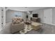 Cozy living room with neutral walls, a beige couch, area rug, and a television at 20 Wes Sandling Rd, Franklinton, NC 27525