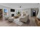 Bright living room featuring a fireplace, large windows, and modern furnishings at 20 Wes Sandling Rd, Franklinton, NC 27525