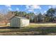 Green storage shed in the backyard at 20 Wes Sandling Rd, Franklinton, NC 27525