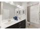Modern bathroom with double vanity and a shower/tub combo at 204 E Fountainhead Ln, Garner, NC 27529