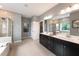 Spa-like bathroom with a soaking tub and walk-in shower at 204 E Fountainhead Ln, Garner, NC 27529