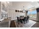 Spacious dining room with a wood table, six chairs, and wainscoting at 204 E Fountainhead Ln, Garner, NC 27529