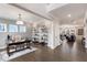 Bright home office with a large desk, built-in shelving, and hardwood floors at 204 E Fountainhead Ln, Garner, NC 27529