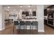 Modern kitchen with island seating and dark cabinetry at 204 E Fountainhead Ln, Garner, NC 27529