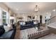 Open living room with ample natural light and views to kitchen at 204 E Fountainhead Ln, Garner, NC 27529