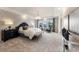 Spacious main bedroom with plush carpet and large windows at 204 E Fountainhead Ln, Garner, NC 27529