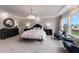 Main bedroom with large bed and backyard views at 204 E Fountainhead Ln, Garner, NC 27529