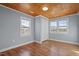 Cozy bedroom with wood flooring and wood paneled ceiling at 2041 Grassy Creek Virgilina Rd, Oxford, NC 27565